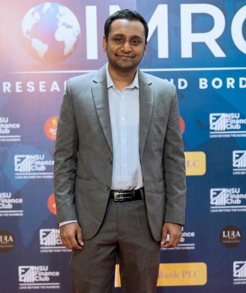 Md Shaheduzzaman in a grey suit at the International Market Research Challenge